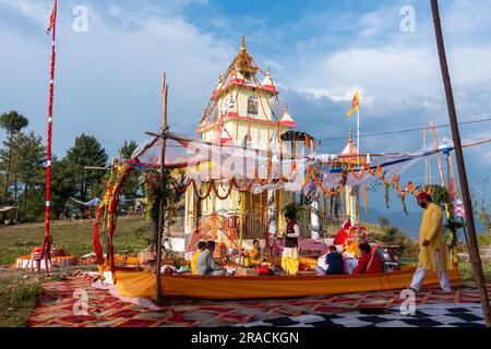 June 28th 2023 Uttarakhand, India. A Decorated Hindu temple dedicated to Naag Devta ( Serpent God) during a religious ceremony with people performing Stock Photo