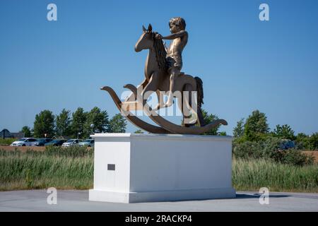 Sculpture park at Arken museum at Ishoj, denmark, in the evening sun - a museum for contemporary art near Copenhagen Stock Photo