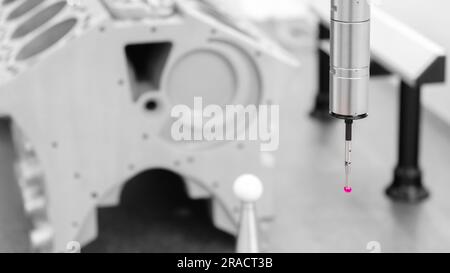 Quality control on milling CNC machine, coordinate measuring machine, Quality control machine. cylinder block of diesel engine repair. Stock Photo