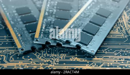 computer memory modules on background of black printed circuit board with golden wires Stock Photo