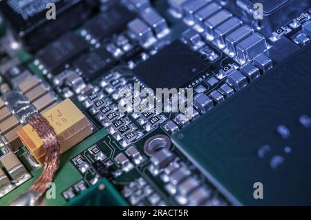 electronic circuit board with passive and active circuit components and IC close-up Stock Photo