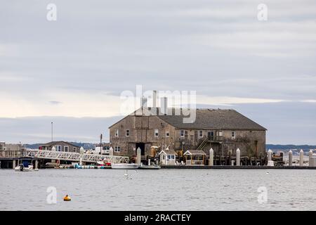 Fishermen's Wharf in Provincetown Marina and Harbor wharf, Provincetown (P-Town), Cape Cod, Massachusetts, New England, USA on a cloudy, overcast day Stock Photo