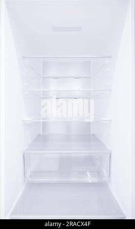 An empty refrigerator. Inside an empty, clean refrigerator, a refrigerator compartment after defrosting. shot with a wide angle lens Stock Photo