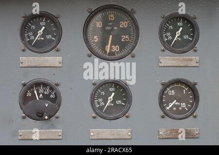 Close-up old control panel of factory machine. Vintage Industrial technology. Stock Photo