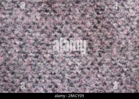 Background texture of grey pink beige pattern stitch knitted fabric made of cotton or wool. Stock Photo