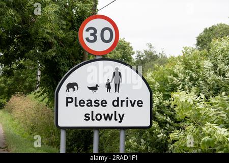 Please drive slowly sign with elephant, Old MIlverton village, Warwickshire, England, UK Stock Photo