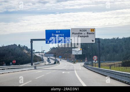 Image of section of the A4 motorway, transmontana motorway, Porto, Vila Real, Portugal. Information board, directions. Beautiful day with high clouds. Stock Photo