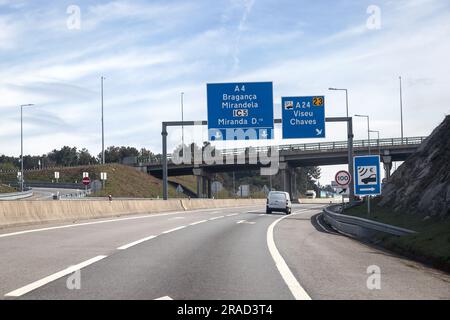 Image of section of the A4 motorway, transmontana motorway, Porto, Vila Real, Portugal. Information board, directions. Beautiful day with high clouds. Stock Photo