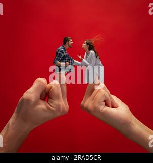 Creative collage with hands. Young man and woman, couple emotionally quarrelling, shouting and arguing with burning emotions. Stock Photo