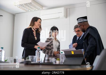 Business people discussing during a conference, international group Stock Photo