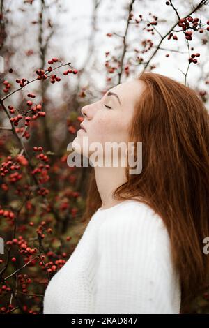 Close-up portrait of teenage girl with red head Stock Photo
