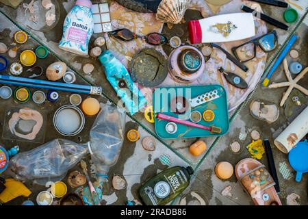 collage assembled from waste plastic products found in the sea, assemblage of non-recyclab le plastic formed into an environmental collage, single use Stock Photo