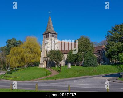 St Nicholas Church ,Wickham,Hampshire.The church is a striking example of a building on a large, almost circular, mound, which had probably been sacre Stock Photo