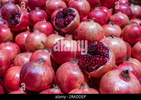 Pile of pomegranate fruit at street market Stock Photo