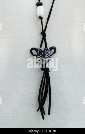 Black color and white color glass necklace on girl Stock Photo