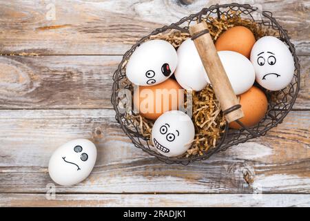Don't put all of your eggs in one basket background. Funny eggs with different mood faces. July 9 - National Dont Put All Your Eggs in One Omelet Day Stock Photo