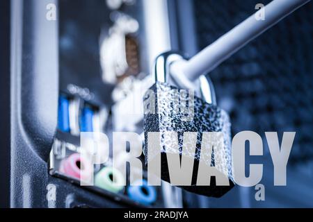 Closed lock hanging on a network cable and word privacy. The concept of security or blocking the Internet or the safety of personal data or privacy. A Stock Photo