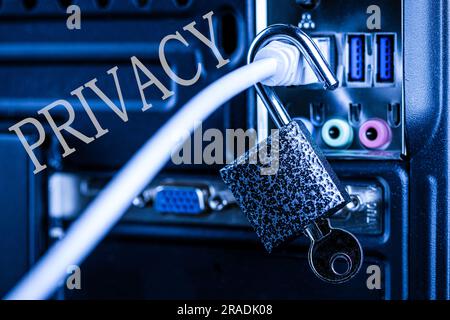 Opened lock hanging on a network cable and word privacy. The concept of opening access, unlocking the Internet or hacking anti-virus protection. Theft Stock Photo