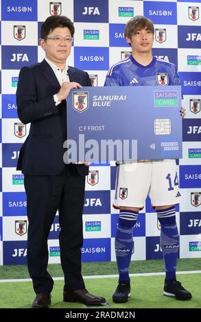 Tokyo, Japan. 3rd July, 2023. Japanese credit card company Credit Saison president Katsumi Mizuno (L) and Japanese professional football player Junya Ito (R) of France's Stade de Reims display a large sample of the credit card as Japan Football Association and Credit Saison managed eight-year partnership at the JFA headquarters in Tokyo on Monday, July 3, 2023. (photo by Yoshio Tsunoda/AFLO) Stock Photo