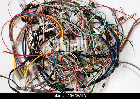 Colored cables and wires with connectors on white background. Chaos of Colorful computer wires and Internet network. Telecommunications. Stock Photo
