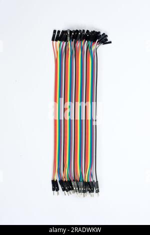 Male to female jumper cable for Arduino. Set of colored connecting wires on white background. Wires for connecting modules and sensors for reliable co Stock Photo