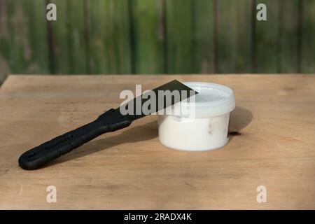 Wooden background and set of plaster trowel tools and spatula on renovation  concept Stock Photo - Alamy