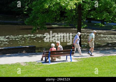 Seniors in the park at the moated castle Borbeck, Essen, North Rhine-Westphalia, Germany Stock Photo