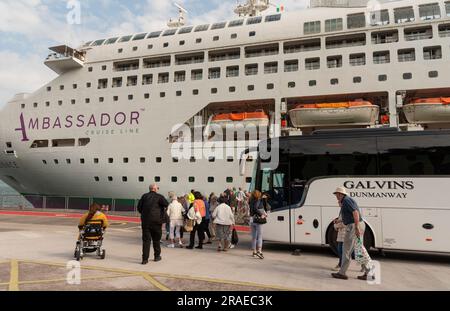 Cobh, Ireland, EU. 9 June 2023.  Cruise passengers exiting a excursion coach and returning to their cruise ship alongside in Cobh Harbour, Ireland. Stock Photo