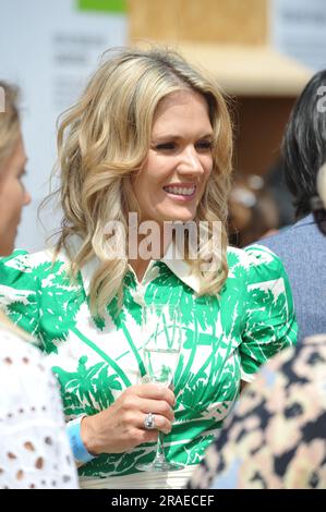 Charlotte Hawkins (English television and radio presenter, newsreader and journalist) at the 2023 Royal Horticultural Society Hampton Court Palace Garden Festival opening day.  Hampton Court Palace Garden Festival, held since 1993, is the most prestigious flower and garden event in the United Kingdom and the world’s largest annual flower show. It takes 18 months to plan and arrange and offers an eclectic mix of beautiful gardens, floral marquees and pavilions, spread over 34 acres, either side of the dramatic long water lake. The largest pavilion, The Floral Marquee is 6,750 square metres, big Stock Photo