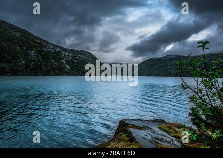 Amazing nature view with fjord and mountains. Beautiful reflection. Location: Scandinavian Mountains, Norway. Artistic picture. Beauty world. The feel Stock Photo