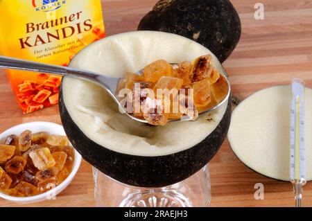 Black radish, root, and brown candy (Raphanus sativus), sugar, preparation of cough syrup Stock Photo