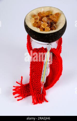 Black radish, root, and brown candy (Raphanus sativus), sugar, preparation of cough syrup, scarf, fever thermometer Stock Photo