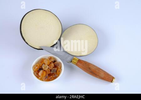 Black radish, root, and brown candy (Raphanus sativus), sugar, ingredients for cough syrup Stock Photo