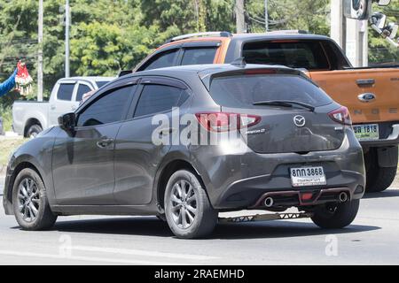 Chiangmai, Thailand -   June  1 2023: Private Eco car Mazda 2. On road no.1001 8 km from Chiangmai Business Area. Stock Photo