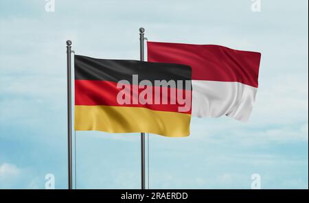 Indonesia flag and Germany flag waving together on blue sky, two country cooperation concept Stock Photo