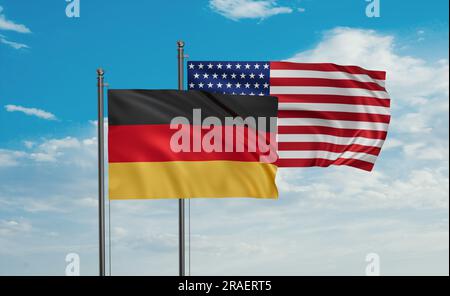 USA and Germany flag waving together in the wind on blue sky, two country cooperation concept Stock Photo