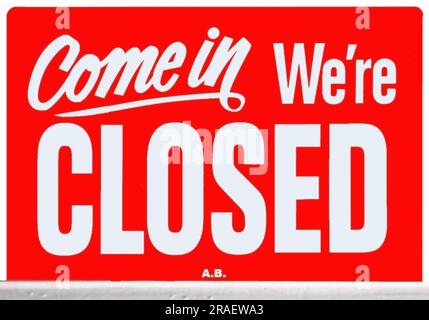 Copenhagen, Denmark - September 15, 2010: White letters on blood red board say, Come In We are Closed. Stock Photo