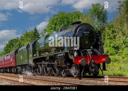 Heritage steam train LMS Royal Scot Class 6115 Scots Guardsman seen running on the main Carlisle to Settle track. Steam and smoke giving atmosphere. Stock Photo