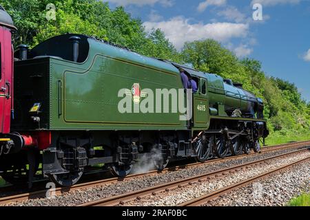 Heritage steam train LMS Royal Scot Class 6115 Scots Guardsman seen running on the main Carlisle to Settle track. Steam and smoke giving atmosphere. Stock Photo