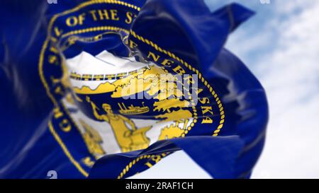 Close-up of the Nebraska state flag fluttering. The flag of is blue with the state seal in the center. 3D illustration render. Close-up. Fluttering fa Stock Photo
