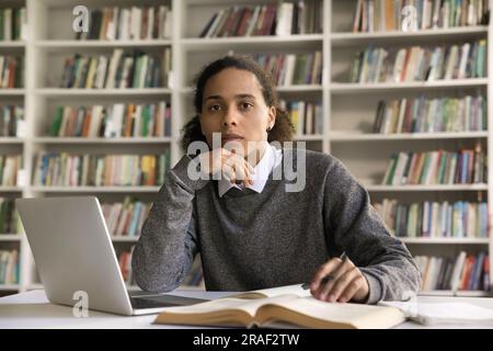 Serious handsome African college student posing for portrait Stock Photo