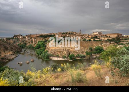 Toledo Spain, view in dramatic light of the historic city of Toledo famously sited on a hill above a bend in the Tagus River, Central Spain Stock Photo