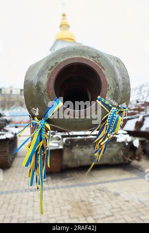 Civilian car shot by Russian soldiers. War in Ukraine. Destroyed russian tank on the Mykhailivs'ka Square. Stock Photo