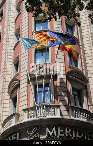 Barcelona, Spain, detail of the detail of flags on public building on the Rambla street, touristic place Stock Photo