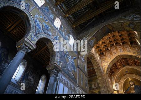 Central nave with Christ Pantocrator who dominates the interior from the apse of the Norman Baroque style Cattedrale di Santa Maria Nuova in Monreale. Stock Photo