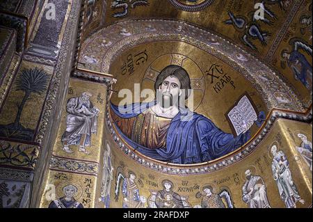 Central nave with Christ Pantocrator who dominates the interior from the apse of the Norman Baroque style Cattedrale di Santa Maria Nuova in Monreale. Stock Photo