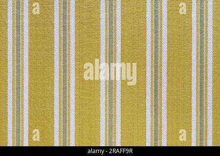 Natural linen texture as background. Cotton fabric with yellow and white  line striped pattern, texture close up. Backdrop, wallpaper. Matereal for cl Stock Photo