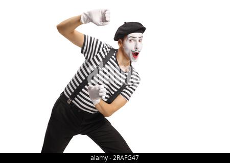 Pantomime man peeking from behind an invisible wall isolated on white background Stock Photo