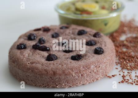 Navara rice vattayappam. Steamed rice cake made with a fermented batter of navara rice and coconut and steamed in a round dish served with kerala egg Stock Photo