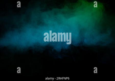 Blue and green steam on a black background. Copy space. Stock Photo